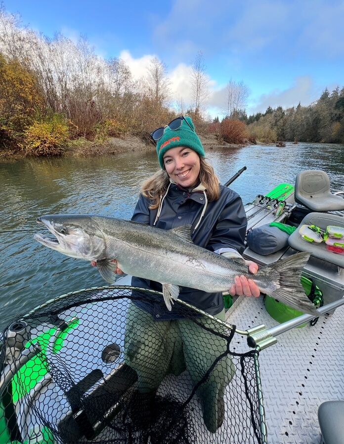 Angler with a silver salmon on the jet sled