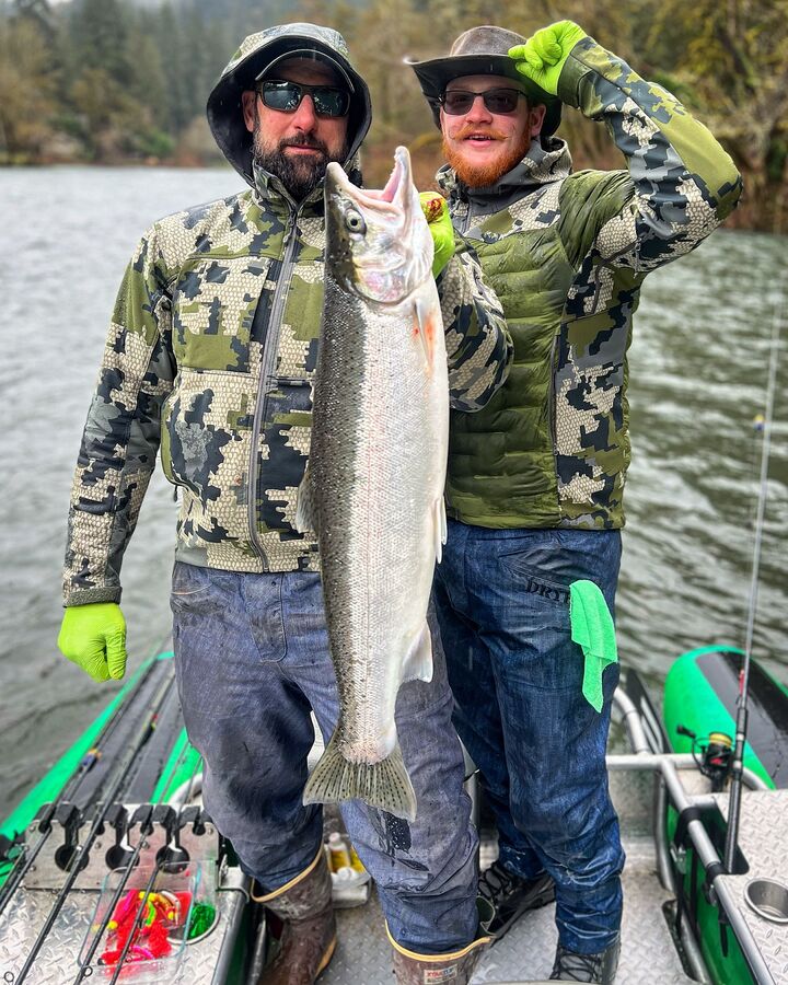 Two anglers with a winter steelhead